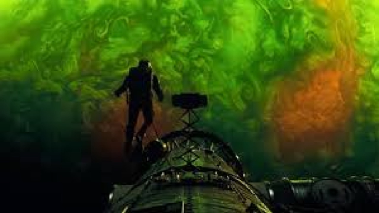 A still from Interstellar: a figure stands by a spacecraft against a luminous green and yellow nebula.